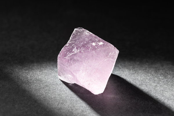 Fluorite crystal healing stone on black background