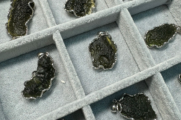 A deep green, rough Moldavite stone