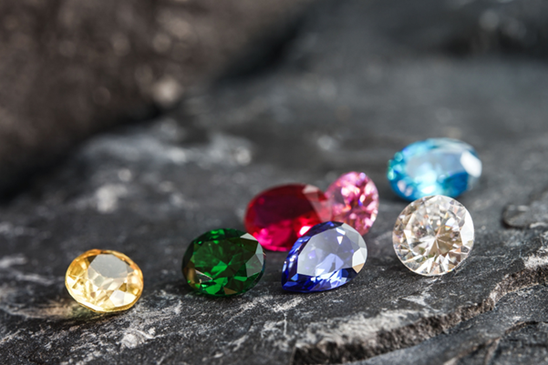 A collection of different colored and cut gemstones