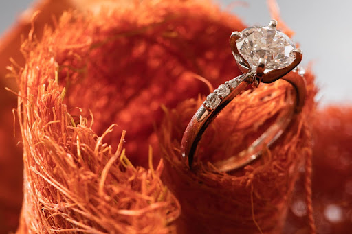 A close-up of a diamond engagement ring representing crystal jewelry.