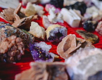 A collection of raw, unpolished crystals.