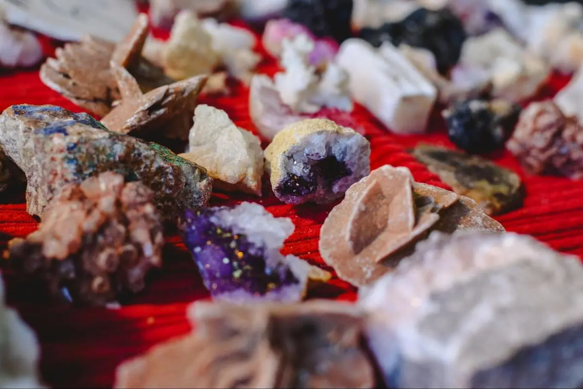 A collection of raw, unpolished crystals.