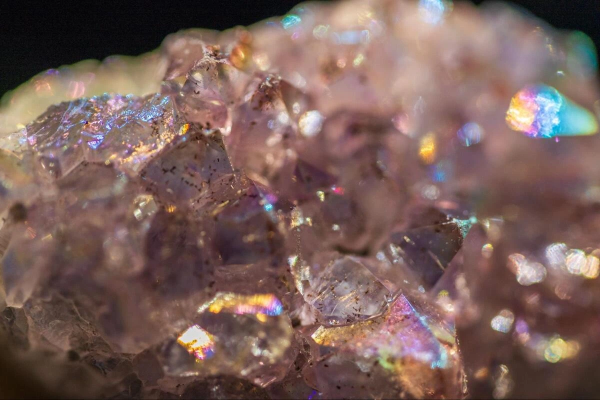 Amethyst Cluster Close-Up Close-up of an amethyst crystal cluster showing rainbow iridescence across the points